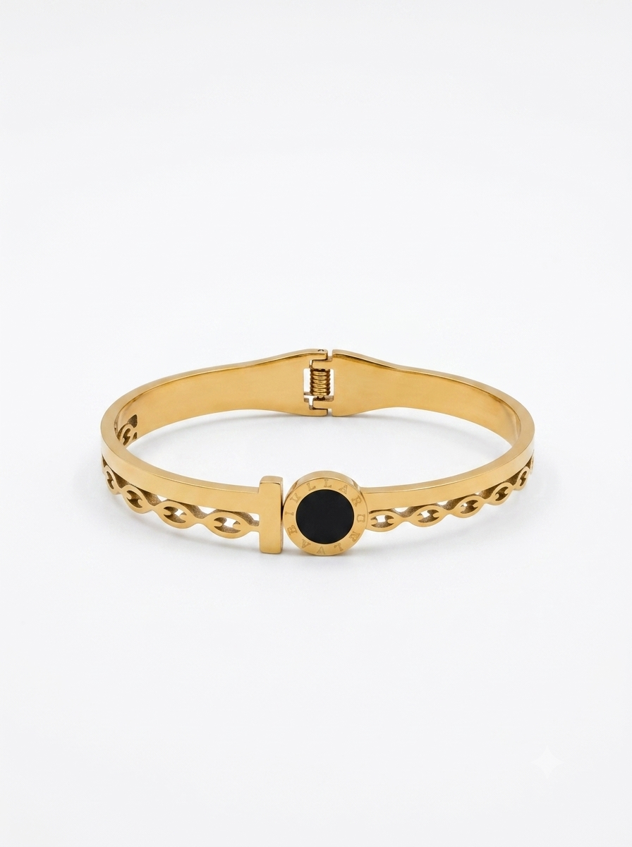 Gold hinged bangle with onyx accent