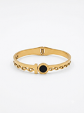 Gold hinged bangle with onyx accent